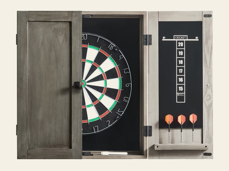 A wooden dartboard cabinet shown open, with a dartboard inside and a scoreboard panel on the right side with three orange-tipped darts inserted.